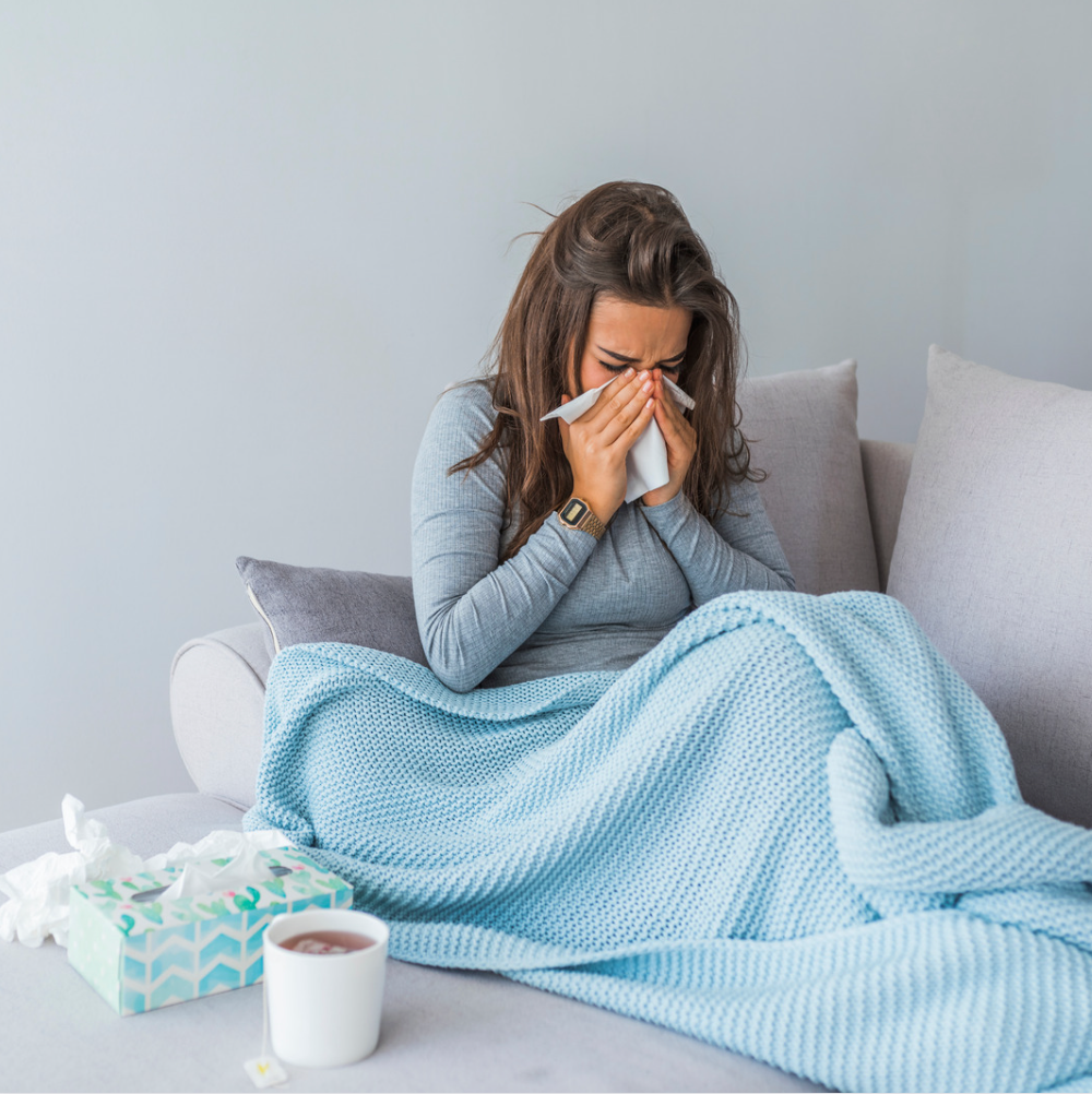 woman blowing nose
