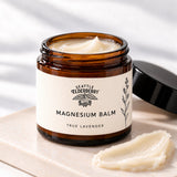 Open Goodnight Magnesium Balm jar showing the balm texture with lavender sprigs (concept render)